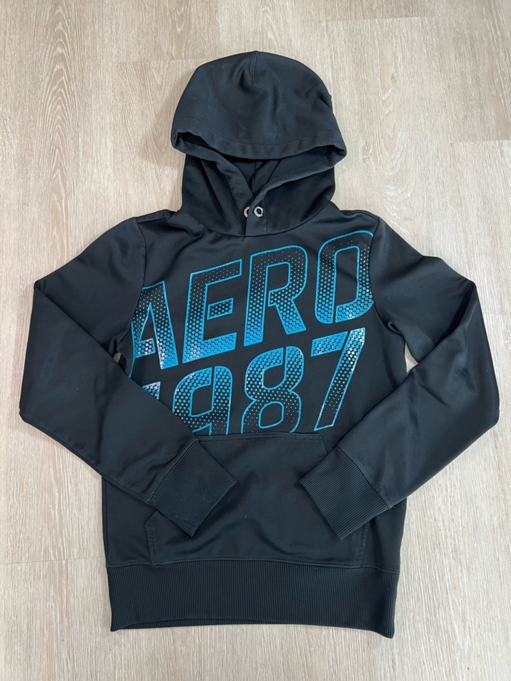 Retro Inspired Black Hoodie with Teal Blue 'AERO 1987' Graphic